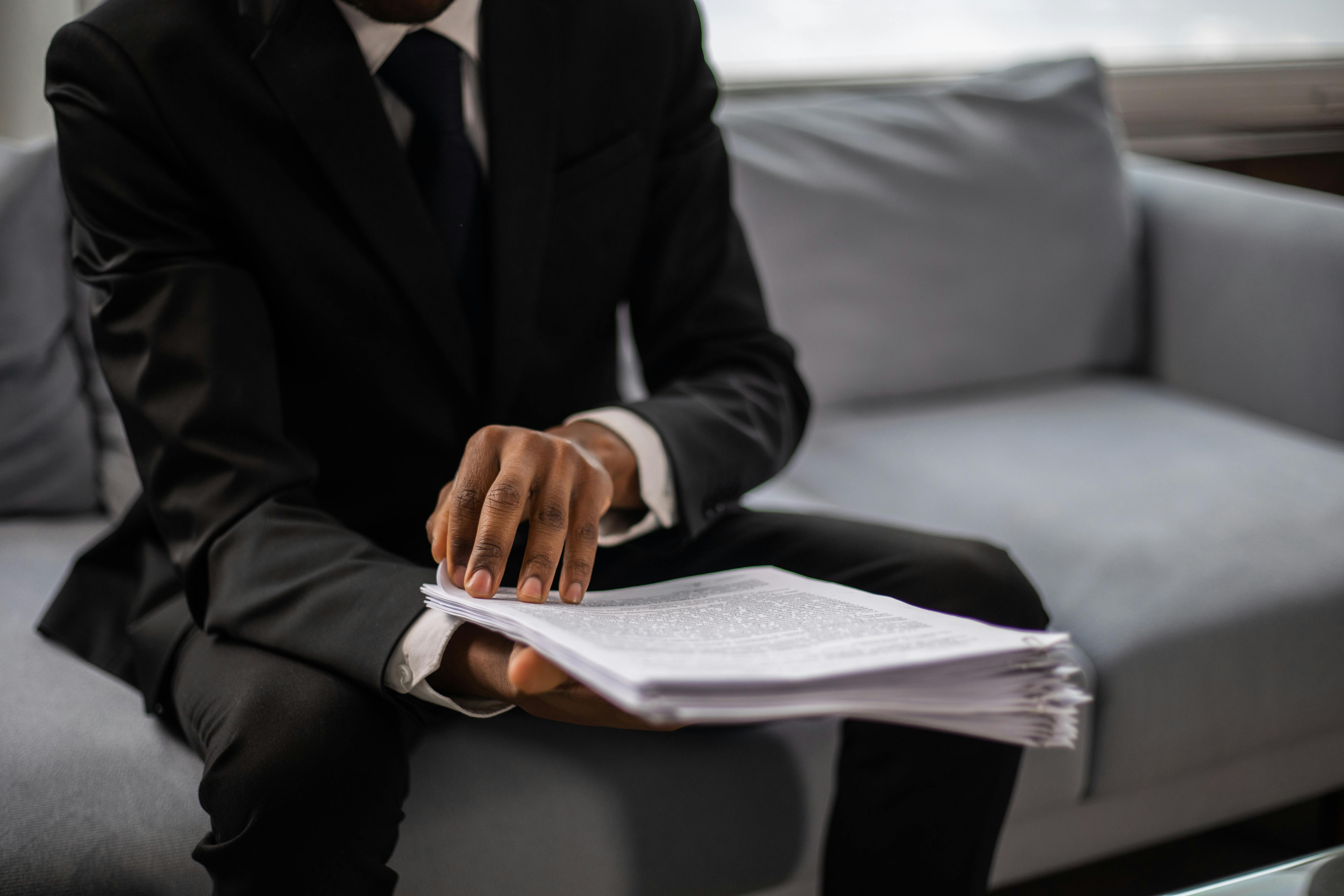 A man reviewing administrative documents | Source: Pexels