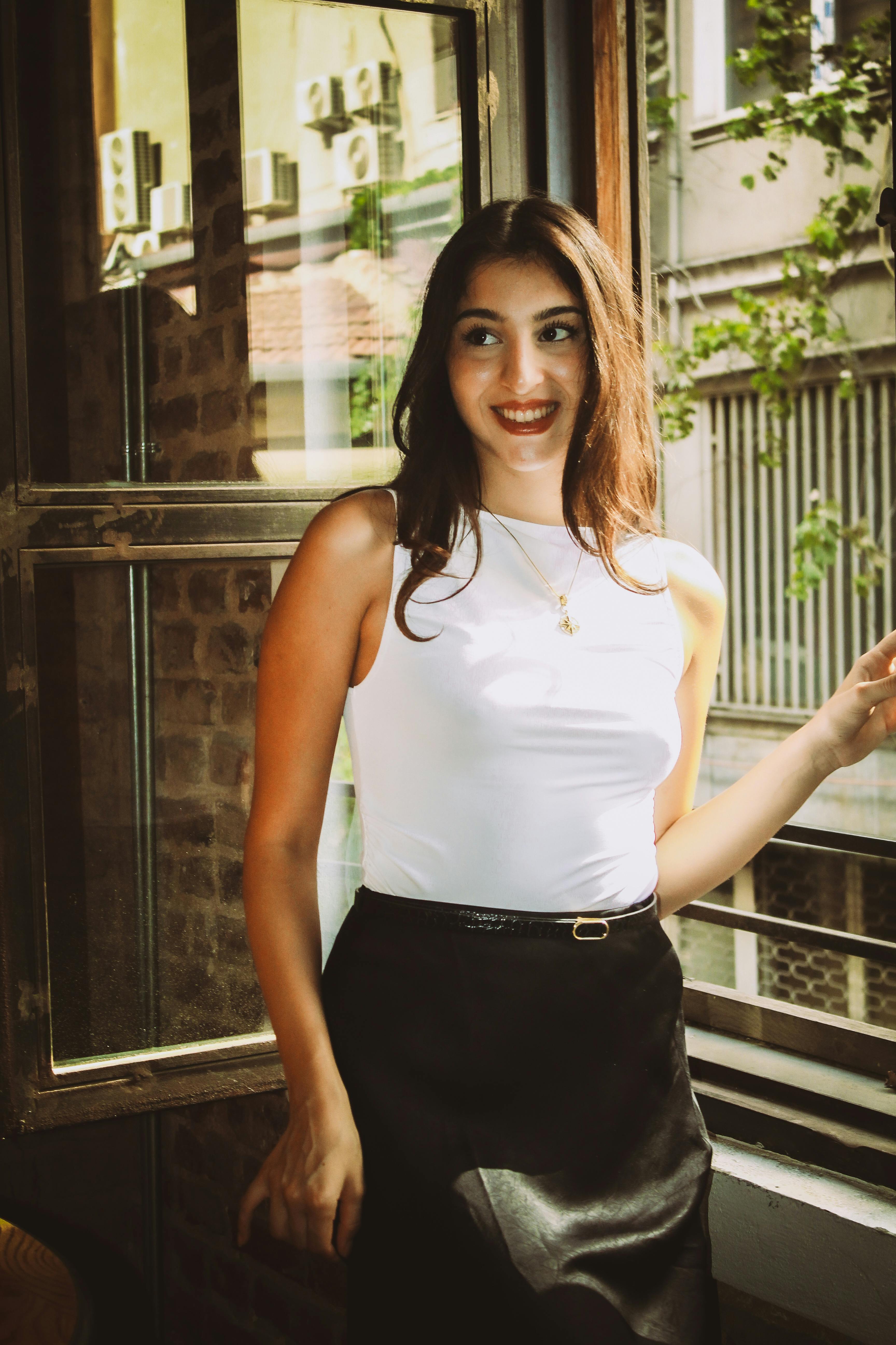 Une femme souriante | Source : Pexels