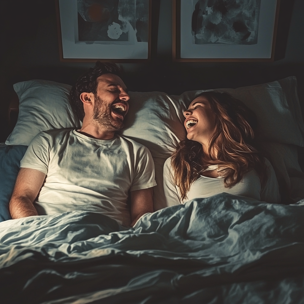 Un homme et une femme qui rient au lit | Source : Midjourney