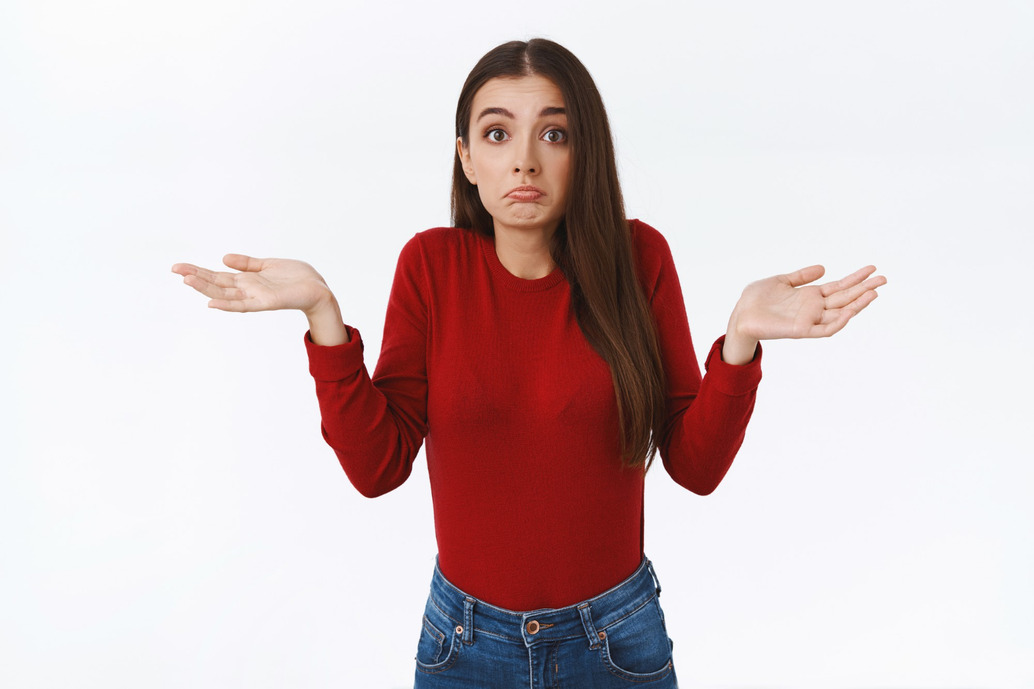 Une femme haussant les épaules | Source : Freepik