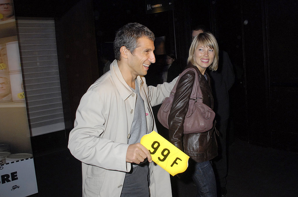 Nagui et Melanie Page assistent au PhotoCall de la première parisienne de "99 Frcs" au cinéma Gaumont Marignan le 20 septembre 2007 à Paris, France. | Source : Getty Images