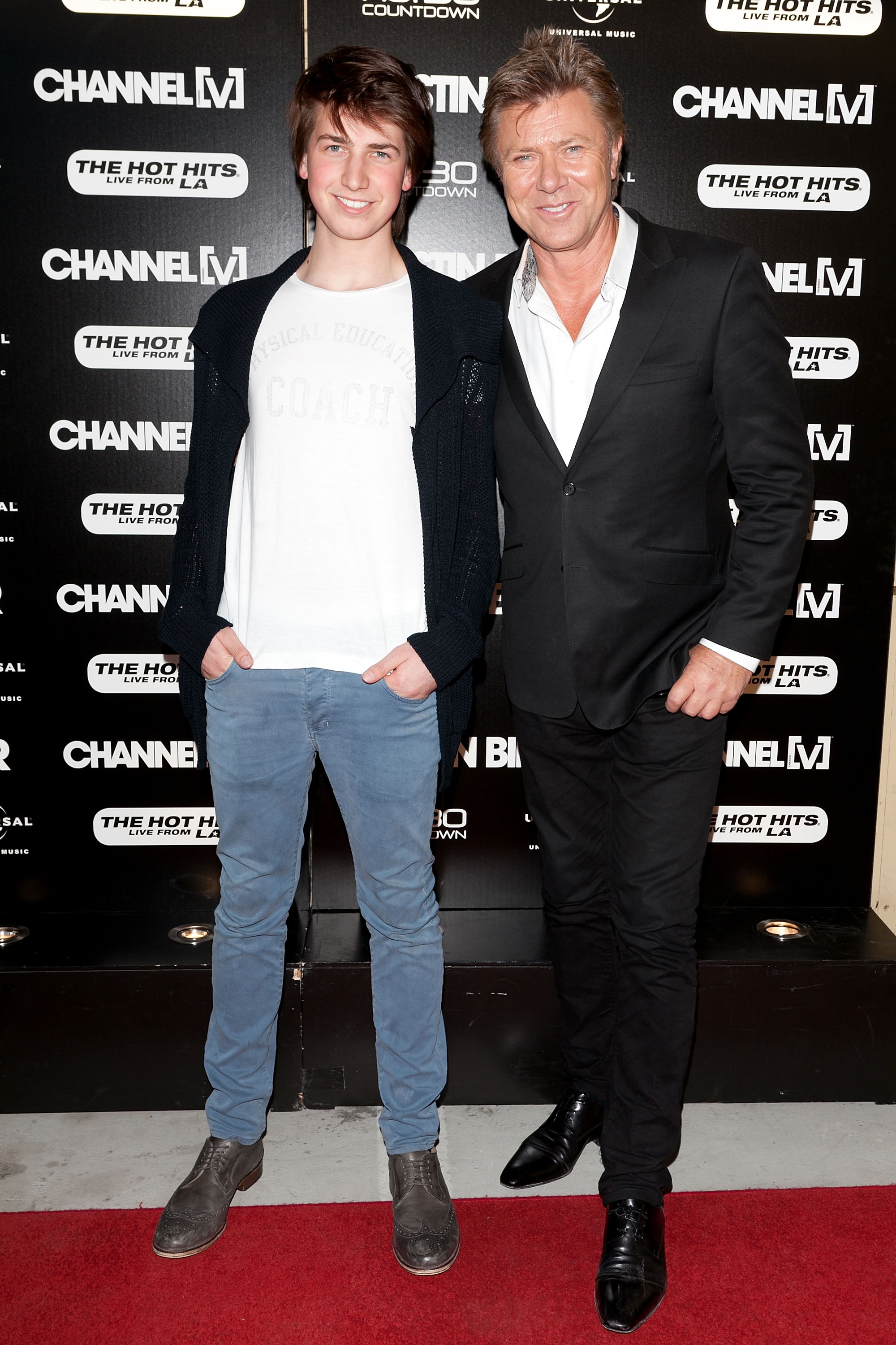 Christian Wilkins et son célèbre père à l'Entertainment Quarter pour le concert acoustique exclusif de Justin Bieber, le 17 juillet 2012, à Sydney, en Australie. | Source : Getty Images