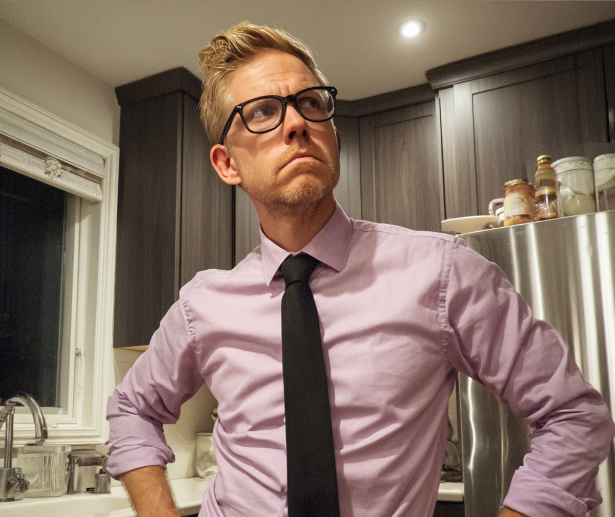 Un homme qui fronce les sourcils debout dans une cuisine | Source : Midjourney