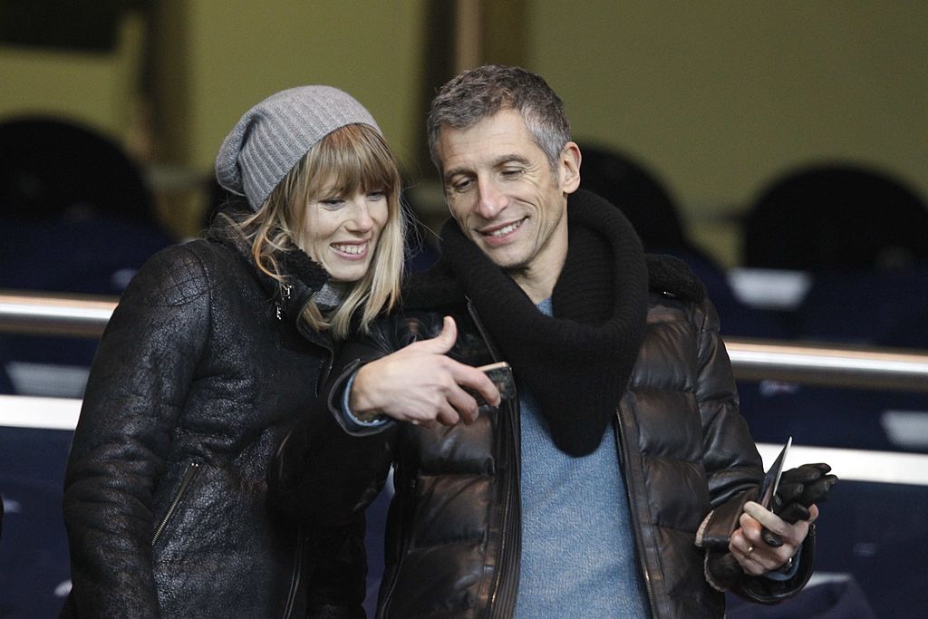 PARIS, FRANCE - 27 FÉVRIER : Mélanie Page et son mari Nagui assistent au match de Coupe de France entre le Paris Saint-Germain FC et l'Olympique de Marseille OM, au Parc des Princes, le 27 février 2013 à Paris, France. (Photo de Xavier Laine/Getty Images)