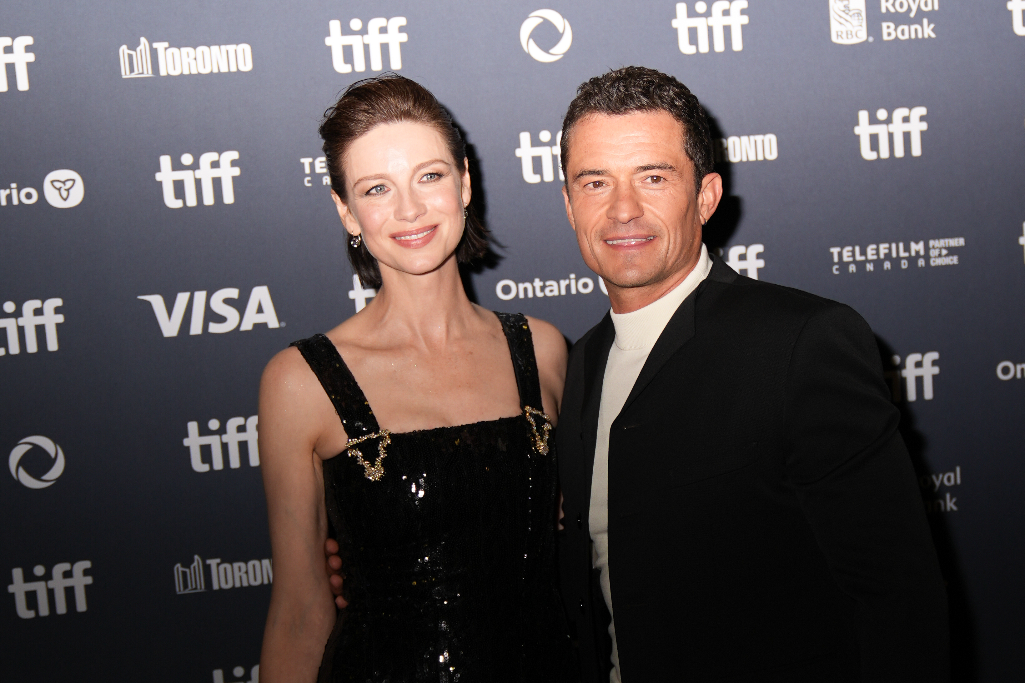 Caitriona Balfe et Orlando Bloom assistent à la première de « The Cut » lors du Festival international du film de Toronto, le 5 septembre 2024 | Source : Getty Images