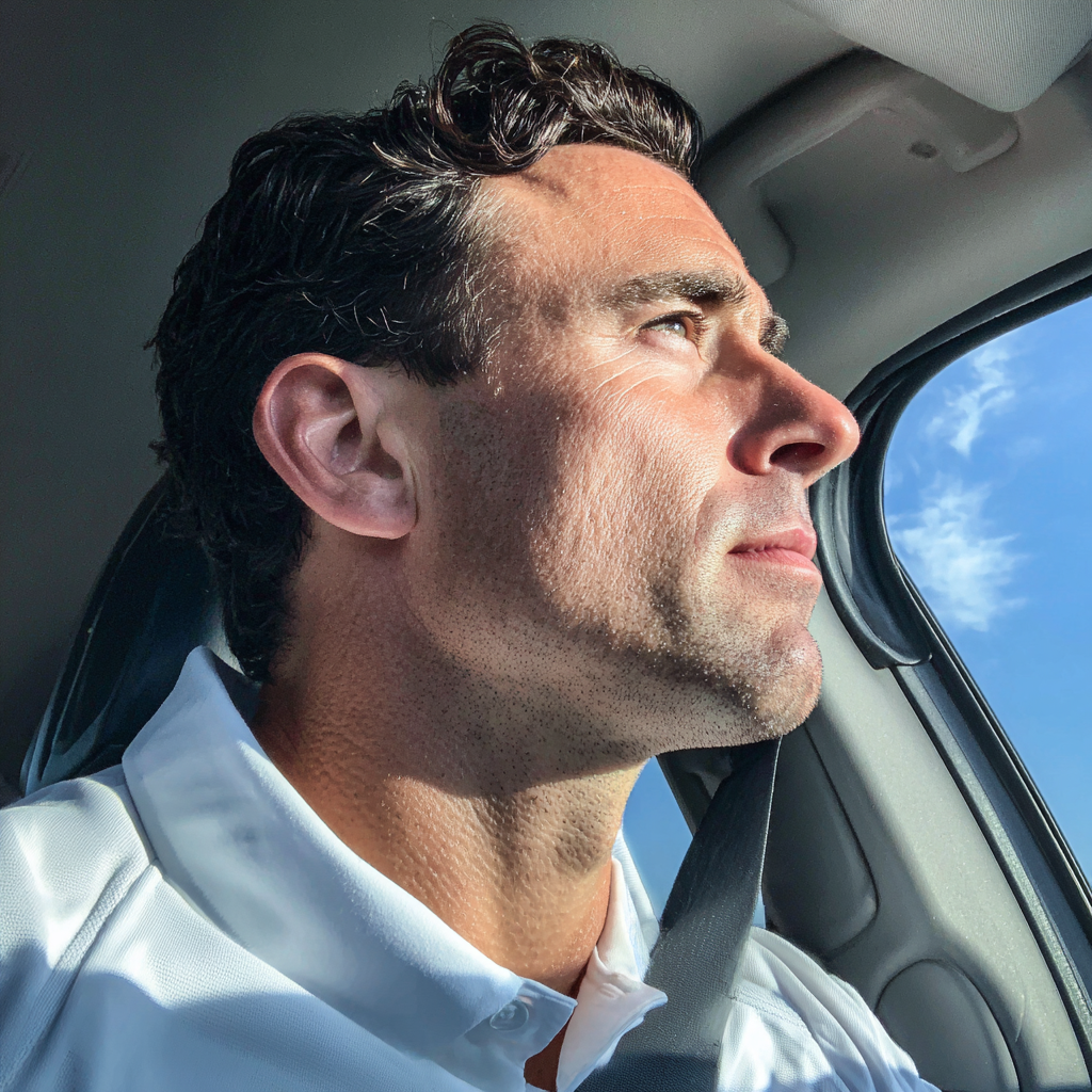 Un homme conduisant une voiture | Source : Midjourney